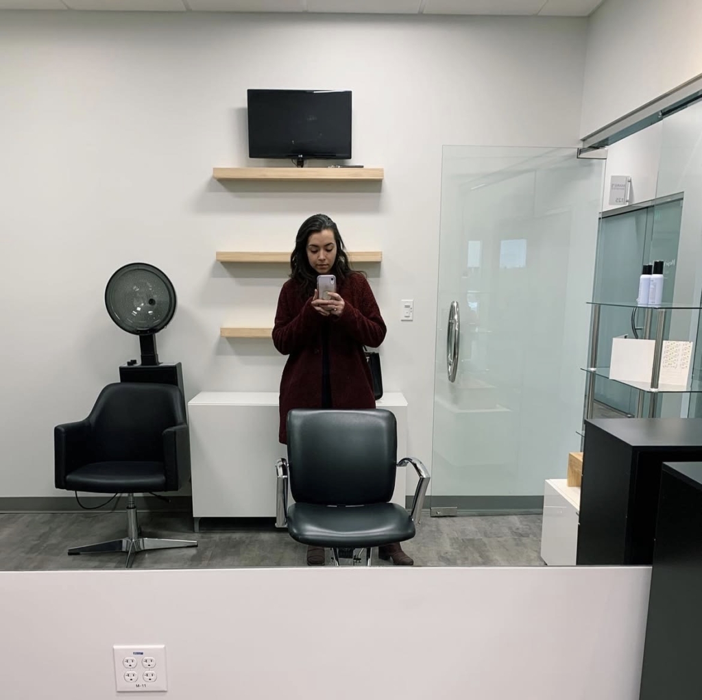 Stylist in her simple salon suite